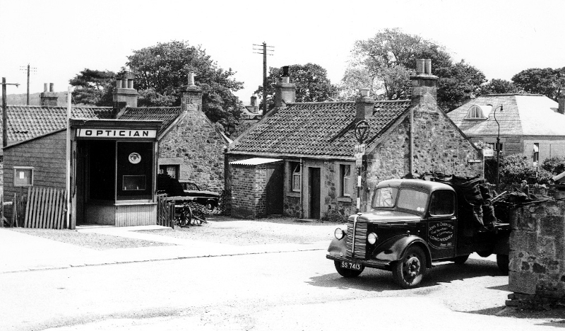 Links Road 1960s. Douglas Welsh’s optician’s premises have long gone. Note Chirnside’s lorry loaded with coal. (A&J Gordon)